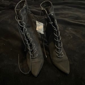 New with tags black heeled boots